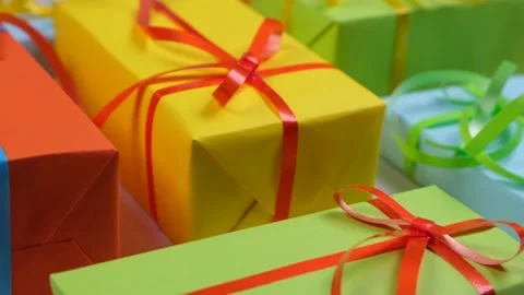 Rotating or spinning background with holiday gift boxes in different colors with Stock Footage 229643862