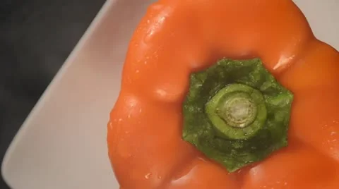 Rotating Orange Bell Pepper - Overhead Video stock 22024347