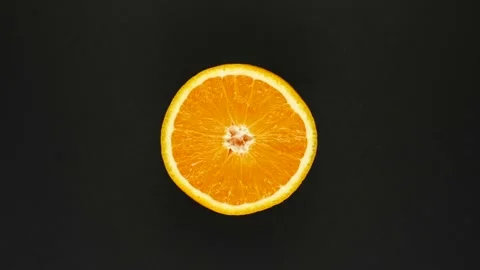 Rotating orange on a black background. Fresh juices, fruits, vitamin and summer Stock Footage 166744564