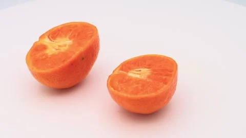 A rotating orange cut in half Video stock 336655918