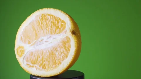 Rotating Orange on a Green Background Stock-Footage 113404327