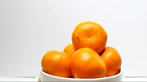 Rotating Oranges in a bowl Stock Footage 67726776