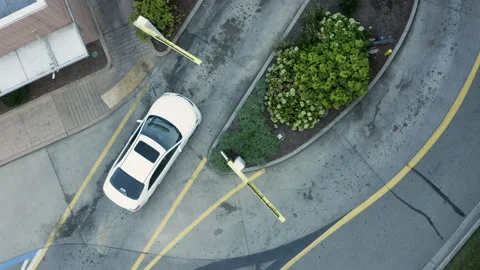 Rotating overhead drone of multiple cars in queue to place order at a fast Stock Footage 141636788