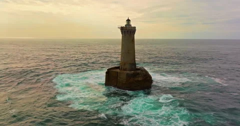 A rotating overhead shot of Phare du Four a lighthouse in Bretagne France. An Stock Footage 304710975