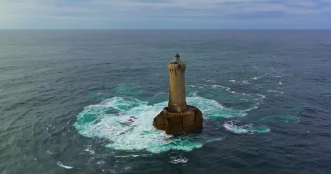 A rotating overhead shot of Phare du Four a lighthouse in Bretagne France. An Stock Footage 304712460