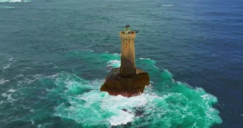 A rotating overhead shot of Phare du Four a lighthouse in Bretagne France. An Stock-Footage 311246952