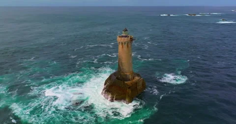 A rotating overhead shot of Phare du Four a lighthouse in Bretagne France. An Stock Footage 311247238