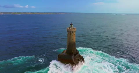 A rotating overhead shot of Phare du Four a lighthouse in Bretagne France. An Stock Footage 311379564