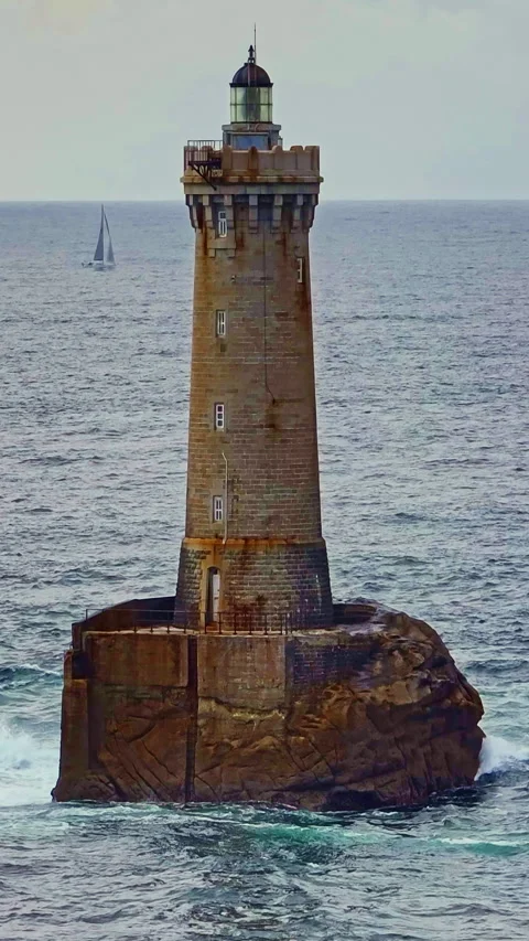 A rotating overhead shot of Phare du Four a lighthouse in Bretagne France. An Stock Footage 319938667