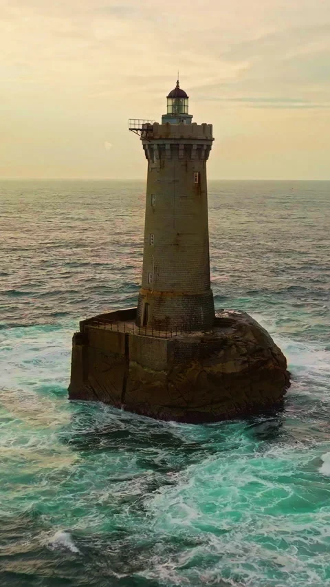 A rotating overhead shot of Phare du Four a lighthouse in Bretagne France. An Vídeos de archivo 320898860