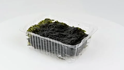 Rotating Pack of Korean Seaweed(Gim) Sheets on White Background Stock Footage 328484276