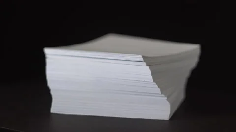 Rotating the paper stack 4K Video stock 154516380