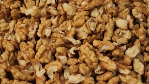 Rotating peeled walnuts as a background Stock Footage 342437909