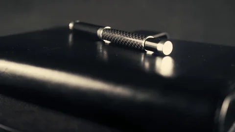 Rotating Pen and notebook 4K video Stock Footage 124849484