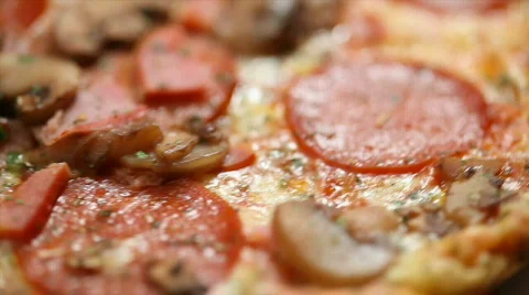 Rotating pepperoni pizza - seamless loop Stock Footage