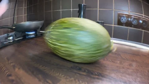 Rotating Piel de Sapo Melon on Kitchen Table Stock-Footage 315991820