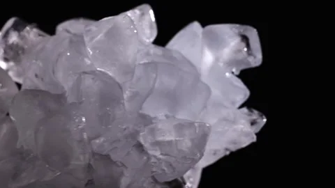 Rotating pile of clear ice chunks on black background for drink cooling, re.. 動画素材 345360642
