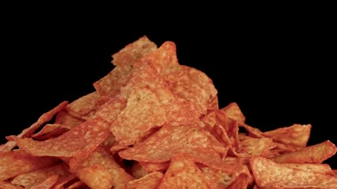 Rotating Pile of Crispy Nacho Tortilla Chips on Black Background Stock Footage 320090757