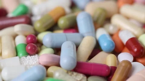 Rotating pile of pills moves through in a loop Stock Footage 161029479