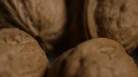 Rotating pile of raw organic walnuts in brown shells Stock Footage 328144252
