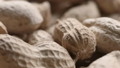 Rotating pile of raw peanuts with shells Stock Footage 119401732
