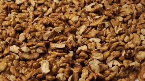 Rotating pile of shelled walnuts closeup Stock Footage 341823148
