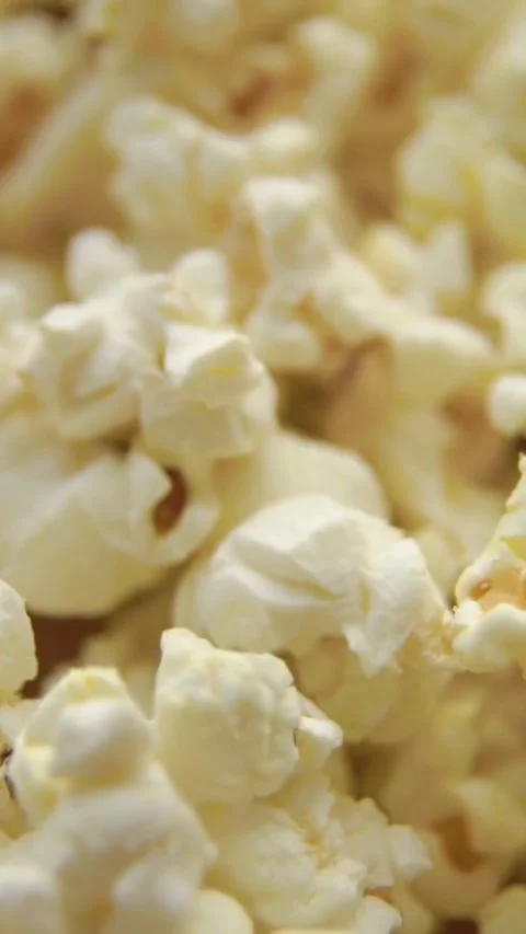 Rotating pile of white salted popcorn snack close up Video stock 334183479