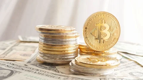 Rotating piles of cryptocurrency coins on dollars, american flag Stock Footage 88424664