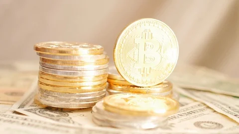 Rotating piles of cryptocurrency coins on dollars, american flag 스톡 동영상 88424685