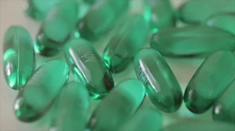 Rotating pills of Advil on white Stock Footage 55862423