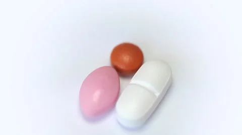 Rotating pills on a white background Video stock 35502161