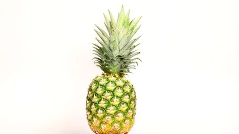 Rotating pineapple in a circle Stock Footage 119954499