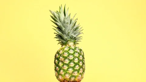 Rotating pineapple in a circle Stock Footage 119954778