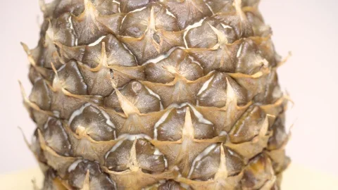 Rotating pineapple (close-up loopable video) Stock Footage 100631745