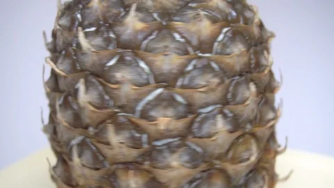 Rotating pineapple (close-up loopable video) Stock Footage 100631763