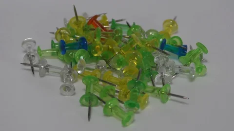 The rotating pins for board on white surface Stock Footage 111887449