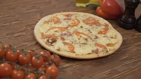 Rotating Pizza tomatoes pepper Stock Footage 69836739