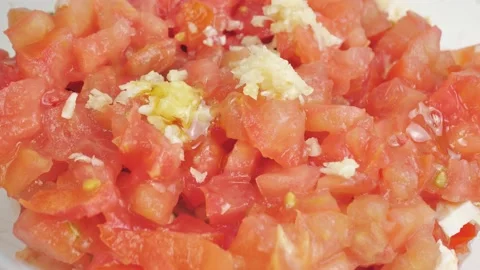 Rotating plate with basil tomatoes and olive oil Stock Footage 156465646
