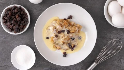 Rotating Plate of Bread Pudding and Custard Sauce Video stock 171175577