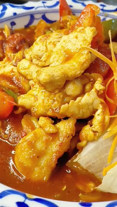 Rotating Plate of Chicken in Red Curry Sauce with Fresh Vegetables, Macro Stock Footage 340011549