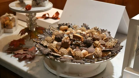 Rotating plate chocolates at the window shop Stock Footage 97363990