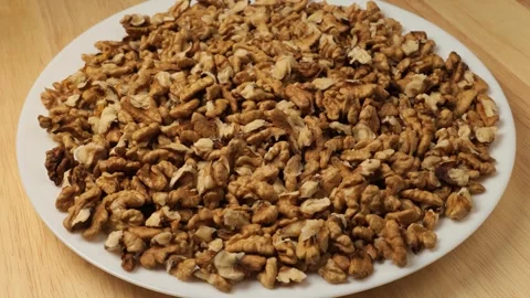 Rotating plate of shelled walnut kernels Stock Footage 341823126