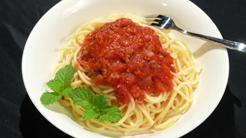 Rotating Plate of Spaghetti Bolognese with Fork Stock Footage 345772923