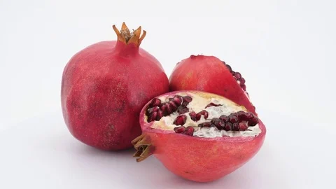 Rotating pomegranate fruit isolated on white background. Stock Footage 83668487