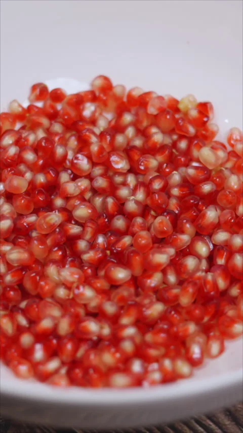 Rotating Pomegranate Seeds. Top View. Vertical. Stock Footage 284836628