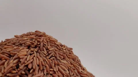 Rotating portion of raw, red rice. Stock Footage 288507431