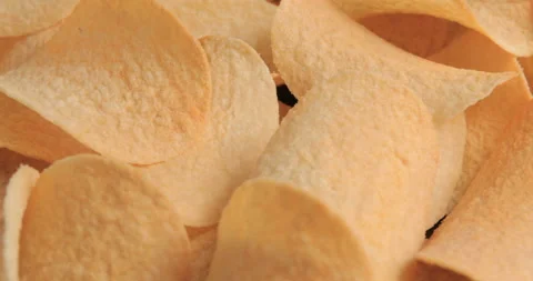 Rotating potato chips close up 스톡 동영상 99812422