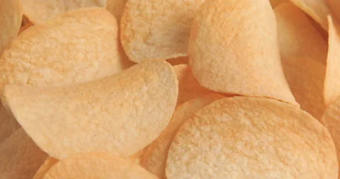 Rotating potato chips close up Stock Footage 99812894