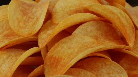 Rotating potato chips close up, macro view food background Stock Footage 67394895