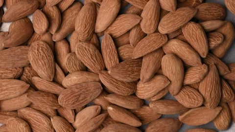 Rotating Premium Raw Almonds Background Top View Healthy Food Macro 4K Video Stock Footage 340747135